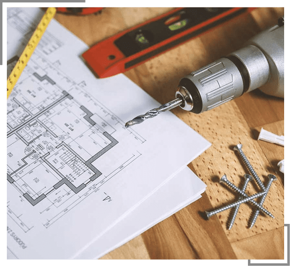 Architectural plans with measuring tape