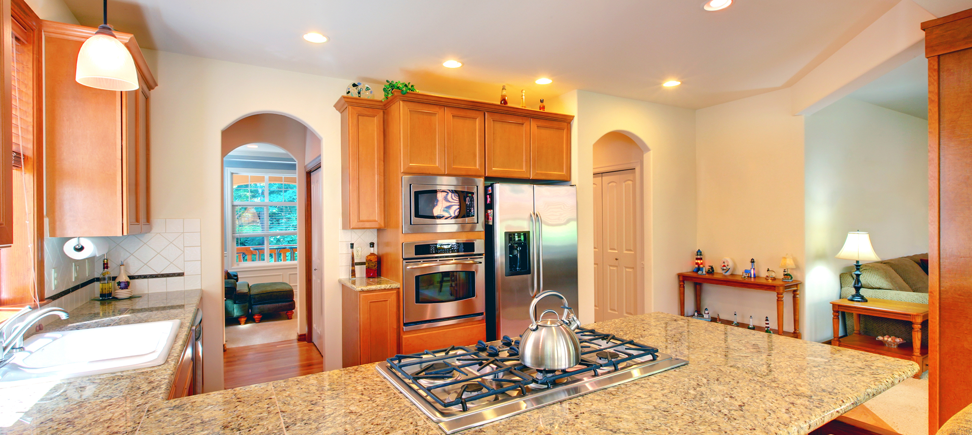 Bright kitchen featuring wooden cabinets