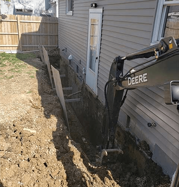 Construction site with trench and excavator